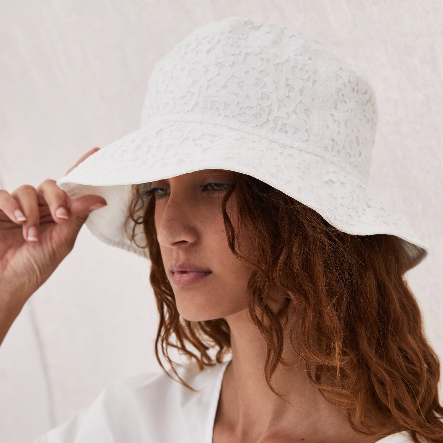 Hand-finished lace bucket hat in white