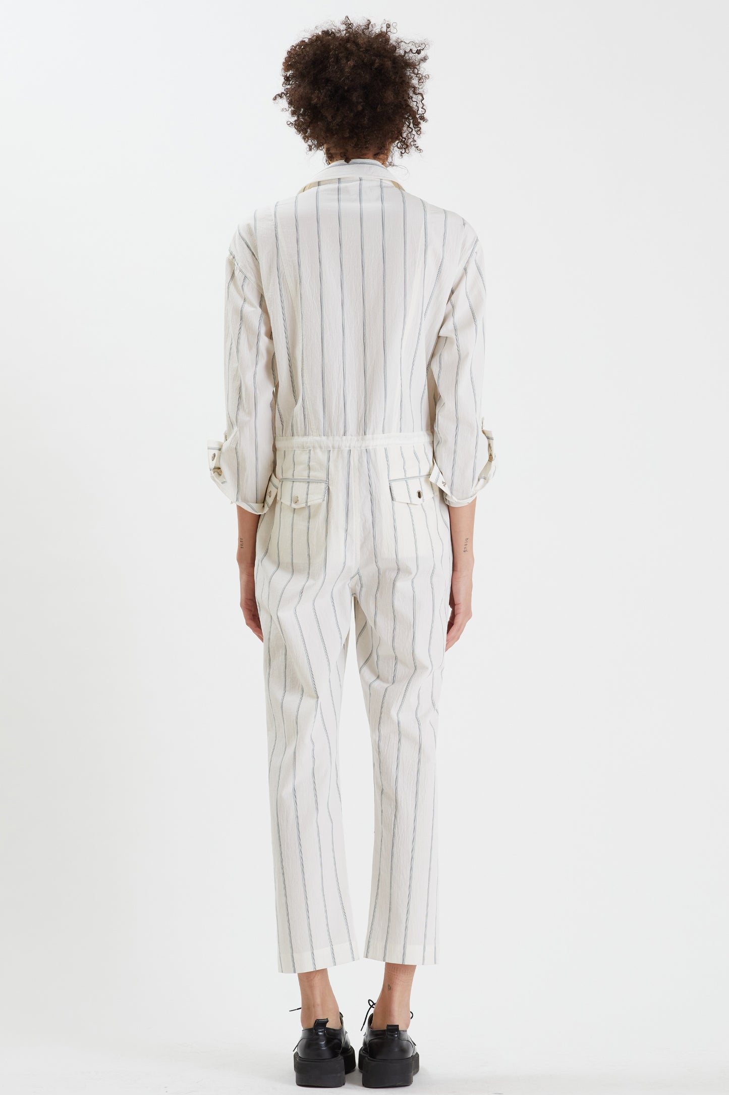 
                  
                    White Striped Jumpsuit
                  
                