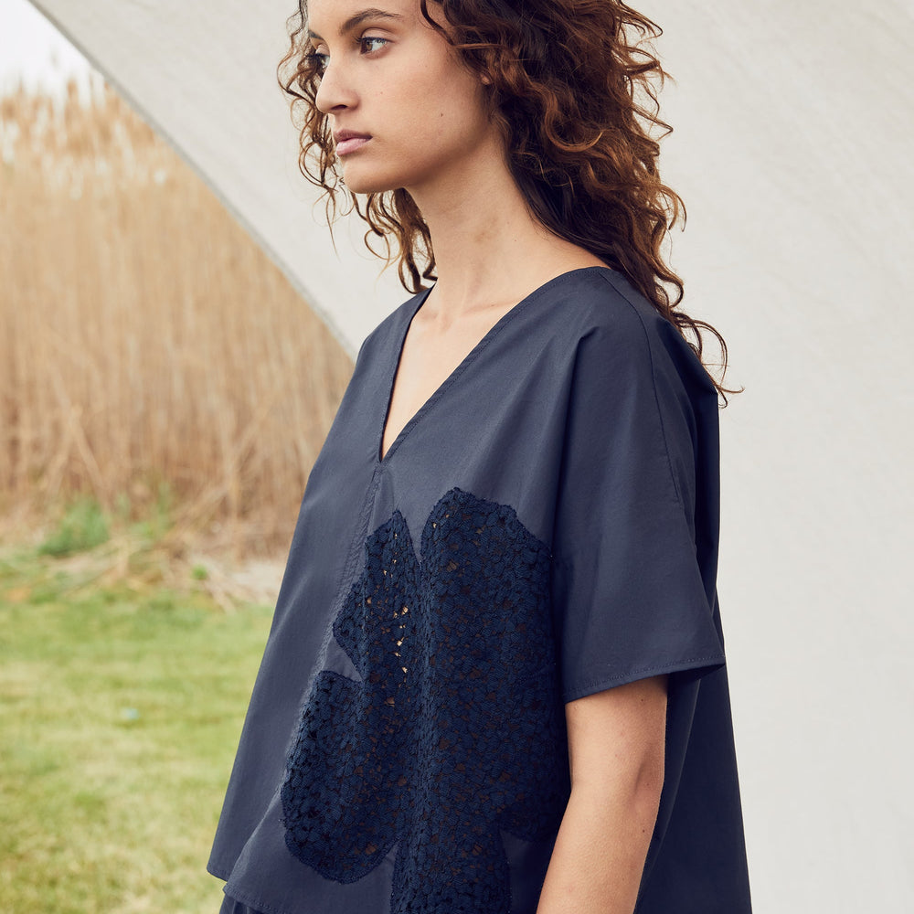 
                  
                    COSMO LACE CUT-OUT TOP
                  
                